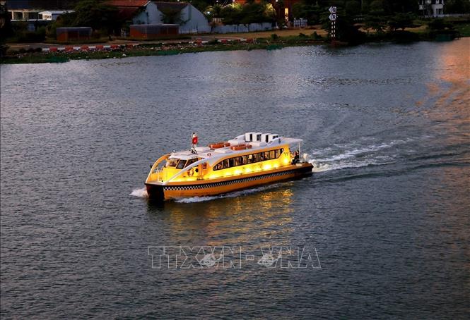 A night-time water bus journey for tourists along the Saigon River. VNA Photo: Hồng Đạt