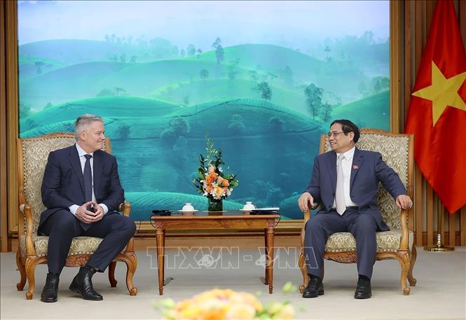 Prime Minister Pham Minh Chinh receives OECD Secretary-General Mathias Cormann. VNA Photo: Dương Giang