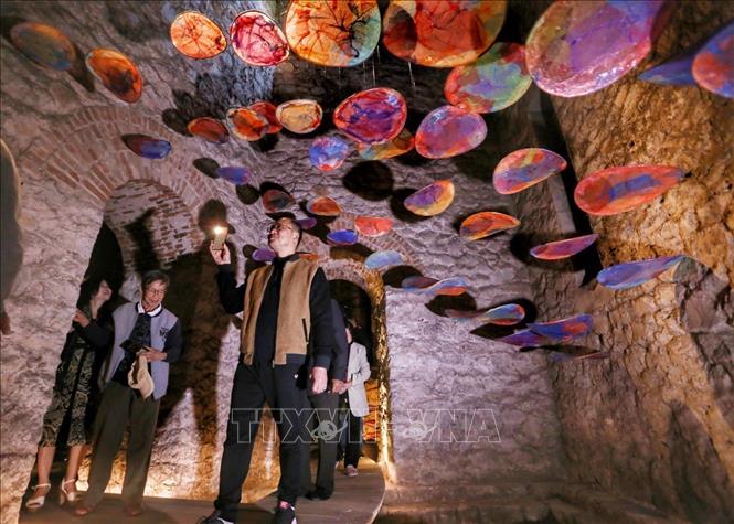 Visitors in Hang Dau water tower with an art space of installation systems. VNA Photo: Tuấn Đức