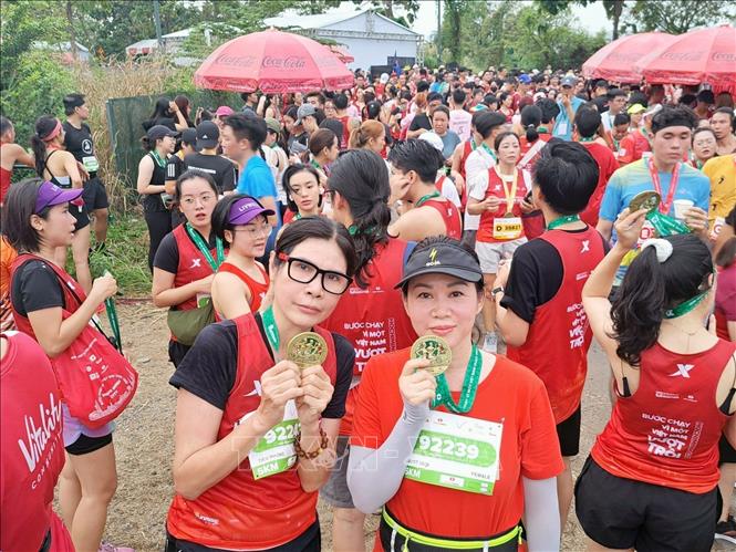More than 30,000 runners from 91 countries and territories participate in Techcombank International Marathon in Ho Chi Minh City on December 10. VNA Photo: Mỹ Phương