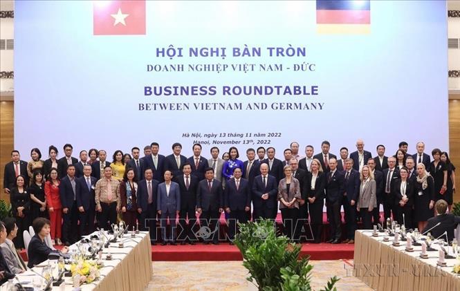 Thủ tướng Phạm Minh Chính và Thủ tướng Đức Olaf Scholz đồng chủ trì Hội nghị bàn tròn với doanh nghiệp Việt Nam - Đức (Hà Nội, 2022). Ảnh: Lâm Khánh - TTXVN