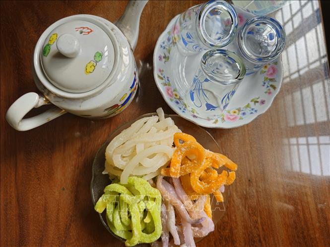 Candied coconut ribbons are often served with green tea to guests on Tet holiday. VNA Photo: Chương Đài