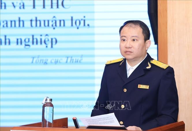 Ông Quách Hào Hiệp, Phó Chánh Văn phòng Tổng cục Thuế (Bộ Tài chính) trình bày tham luận. Ảnh: Tuấn Anh - TTXVN