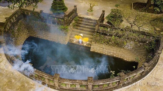A crescent-shaped lake in Thien Ton temple inside the Hoa Lu Ancient Capital’s historical and cultural relics area. VNA Photo 