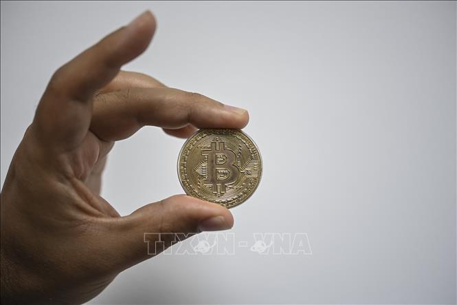 Đồng tiền điện tử bitcoin tại Caracas, Venezuela. Ảnh: AFP/TTXVN