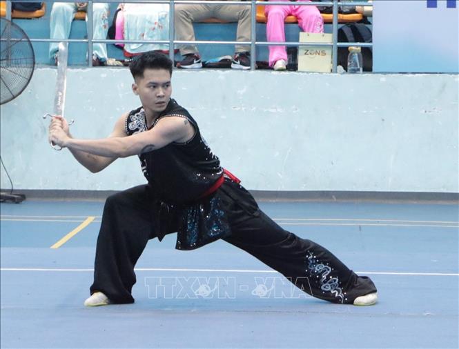 Vận động viên tranh tài nội dung Taolu. Ảnh: Đinh Hương - TTXVN