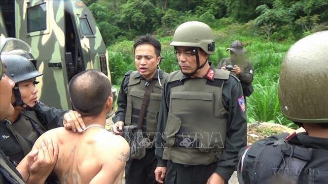 Lực lượng CSCĐ tham gia tác chiến, bắt giữ đối tượng có lệnh truy nã trong chuyên án triệt phá sào huyệt trùm ma túy ở Lóng Luông, huyện Vân Hồ, tỉnh Sơn La (6/2018). Ảnh: TTXVN phát