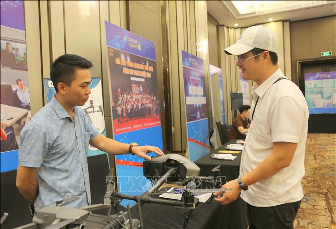 AIM Tech Company introduces a drone at the event. VNA Photo: Minh Thu