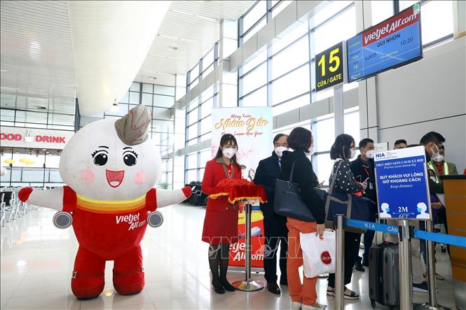 A mascot of Vietjet Air welcome visitors at Noi Bai International Airport. VNA Photo