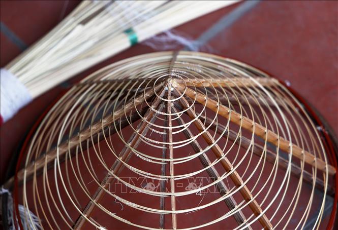Conical frames made from thin bamboo sticks are used to make non la (conical hats). VNA Photo: Hồng Đạt