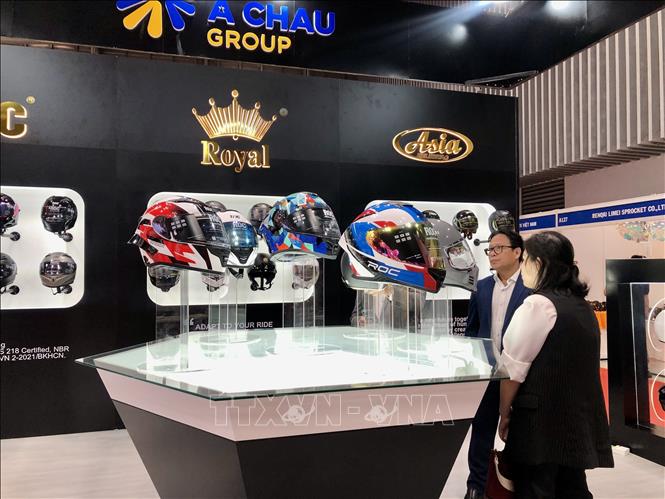 A Chau Group’s helmets on display at the exhibition. VNA Photo: Mỹ Phương