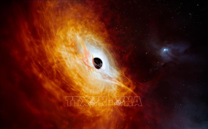 (Tư liệu) Hình ảnh do Tổ chức Nghiên cứu thiên văn châu Âu tại Nam Bán cầu công bố ngày 21/2/2024 cho thấy lõi sáng của một thiên hà được cung cấp năng lượng bởi một hố đen siêu lớn. Ảnh: AFP/TTXVN