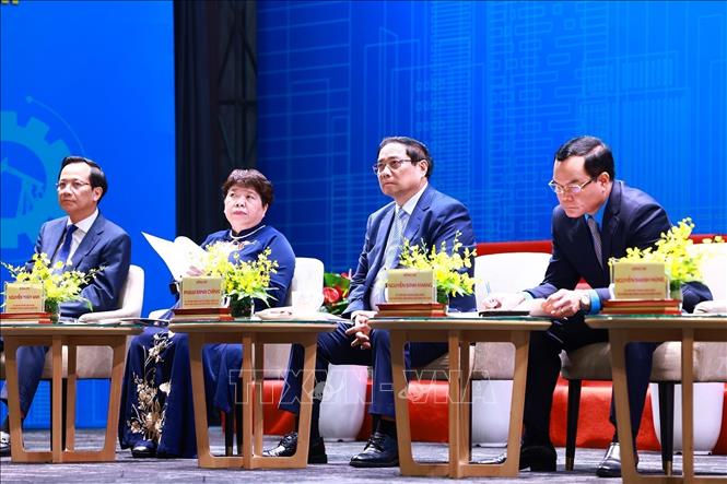 Prime Minister Pham Minh Chinh attends the national forum on labour productivity held by the Vietnam General Confederation of Labour in Hanoi on May 26. VNA Photo: Dương Giang