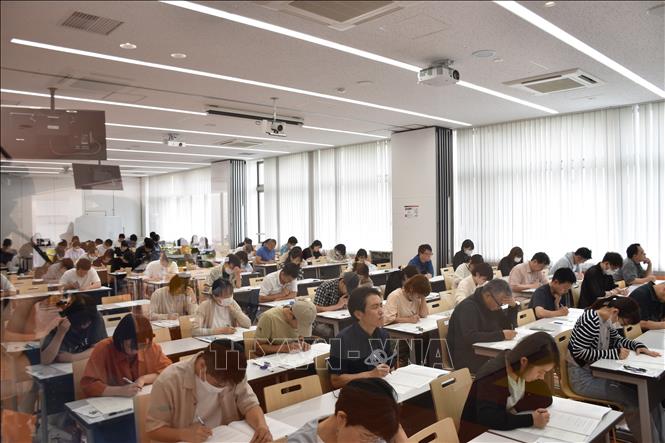 Candidates taking the Vietnamese listening test. VNA Photo