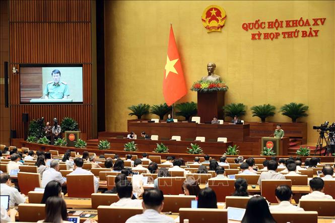 Bộ trưởng Bộ Công an Lương Tam Quang trình bày Tờ trình về dự án Luật Phòng cháy, chữa cháy và cứu nạn, cứu hộ. Ảnh: An Đăng - TTXVN