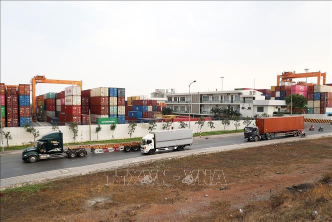 Container trucks operate at the Binh Duong port in Di An city, the southeastern province of Binh Duong. VNA Photo: Hồng Đạt 