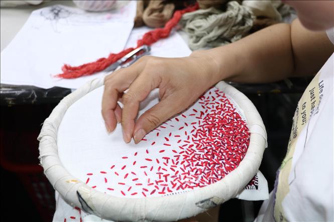 Each piece of embroidery take an enormous amount of time to be completed. The quality of the piece has reached export standards. VNA Photo: Thùy Dung