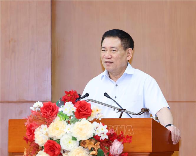 Đồng chí Hồ Đức Phớc, Uỷ viên Trung ương Đảng, Bộ trưởng Bộ Tài chính trình bày tham luận tại hội nghị. Ảnh: Phương Hoa – TTXVN