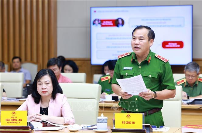 Thứ trưởng Bộ Công an Nguyễn Văn Long báo có công tác triển khai Đề án 06 của Chính phủ. Ảnh: Dương Giang-TTXVN