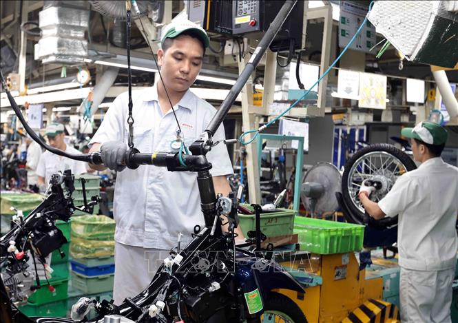 Dây chuyền sản xuất  xe gắn máy tại nhà máy Honda Phúc Yên, Vĩnh Phúc. Ảnh: Trần Việt - TTXVN