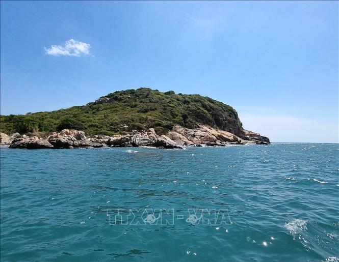 When viewing Vinh Hy from the open sea, one can witness the majestic cliffs and the foaming white waves crashing against them.