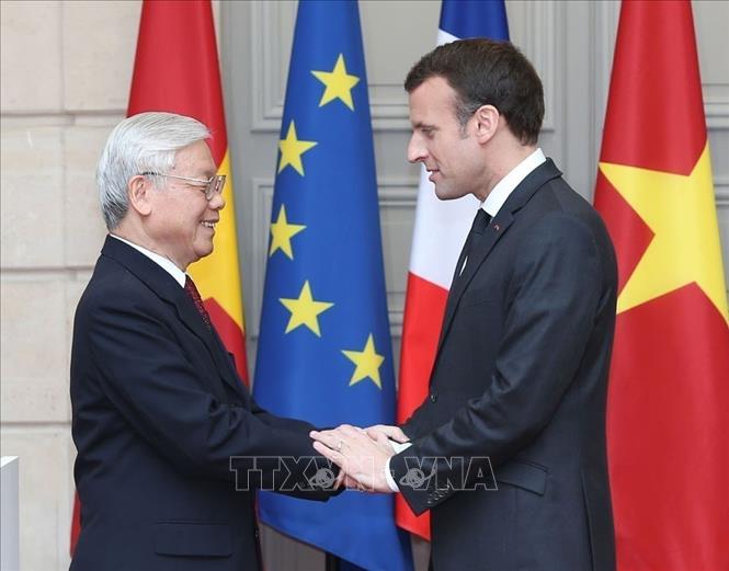 Tổng thống Emmanuel Macron đón Tổng Bí thư Nguyễn Phú Trọng thăm chính thức Cộng hòa Pháp (Paris, 27/3/2018). Ảnh: Trí Dũng – TTXVN