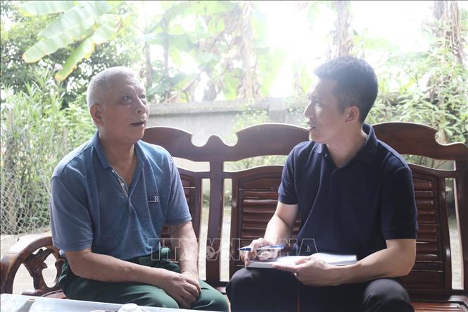 Ông Triệu Quốc Tài chia sẻ cảm xúc với phóng viên. Ảnh: TTXVN phát