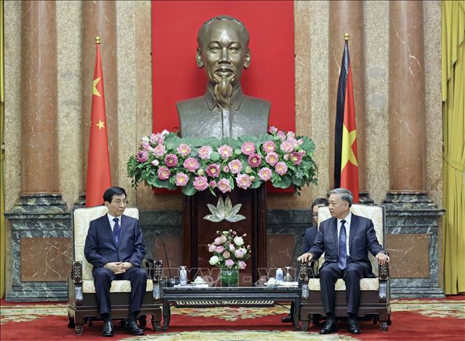President To Lam receives Wang Huning, chairman of the National Committee of the Chinese People's Political Consultative Conference. VNA Photo: Nhan Sáng