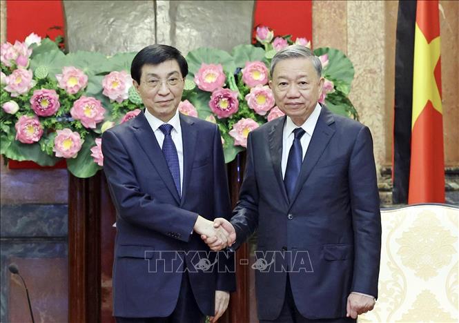 President To Lam receives Wang Huning, chairman of the National Committee of the Chinese People's Political Consultative Conference. VNA Photo: Nhan Sáng
