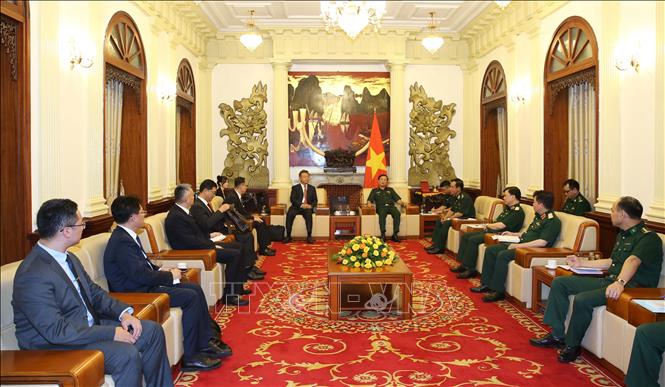 Thượng tướng Hoàng Xuân Chiến tiếp đồng chí Lý Tuấn Kiệt, Phó Cục trưởng Cục Quản lý di dân quốc gia Trung Quốc. Ảnh: Hồng Pha/TTXVN phát