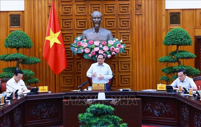 Prime Minister Pham Minh Chinh chairs a meeting of permanent Cabinet members and ministries and agencies in Hanoi on August 14. VNA Photo: Dương Giang