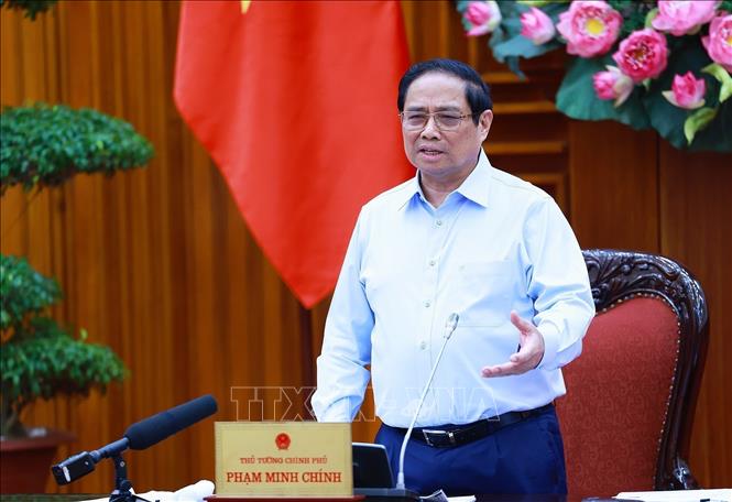 Prime Minister Pham Minh Chinh chairs a meeting of permanent Cabinet members and ministries and agencies in Hanoi on August 14. VNA Photo: Dương Giang