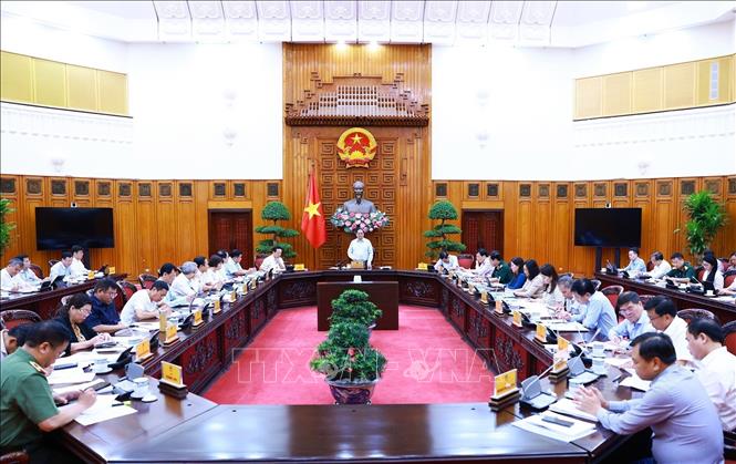 Prime Minister Pham Minh Chinh chairs a meeting of permanent Cabinet members and ministries and agencies in Hanoi on August 14. VNA Photo: Dương Giang