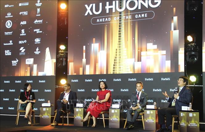 Specialists and business representatives discuss at the forum. VNA Photo: Mỹ Phương