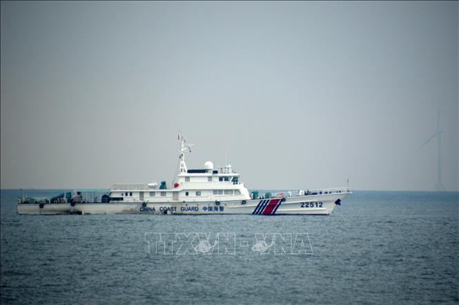 Cảnh sát biển Việt Nam - Trung Quốc tuần tra chung trên vùng biển phía Bắc Vịnh Bắc Bộ. Ảnh: TTXVN
               