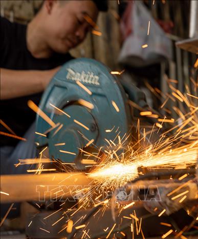Inside a shop on Hang Thiec street. VNA Photo: Hoàng Hiếu 