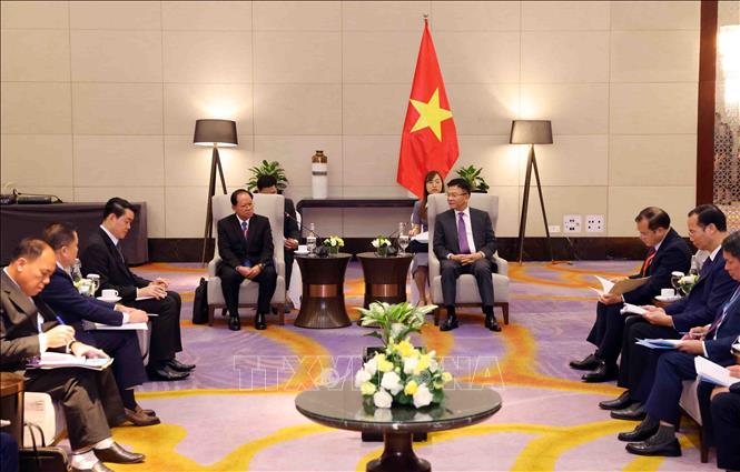 Phó Thủ tướng Chính phủ Lê Thành Long tiếp Thứ trưởng Bộ Công an Lào Khamking Phuilamanyvong. Ảnh: Phạm Kiên - TTXVN