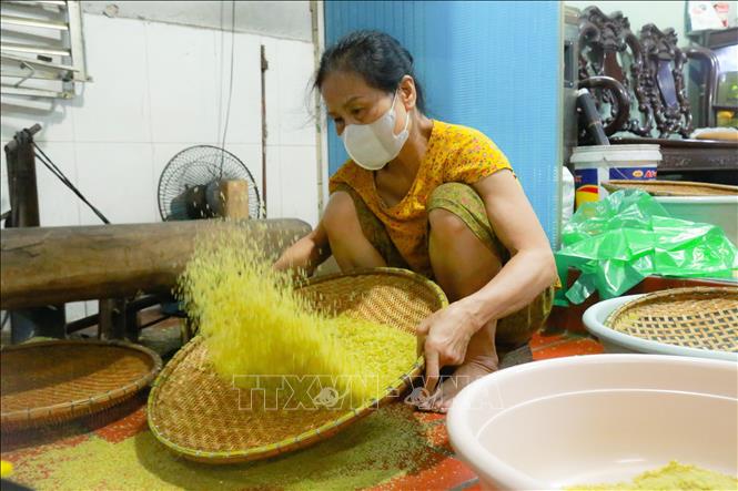 Husks are removed, resulting in flat, green, and fragrant rice grains. VNA Photo