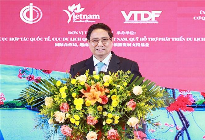 Prime Minister Pham Minh Chinh speaks at the programme introducing VIetnam culture and tourism in Chongqing city. VNA Photo: Dương Giang