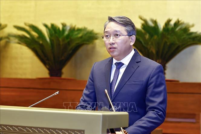 Minister of Justice Nguyen Hai Ninh delivers a report on the enforcement of judgments for 2024. VNA Photo: Doãn Tấn 