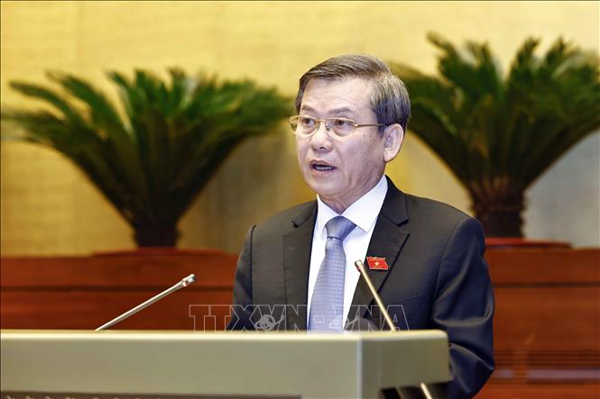 Chief Justice of the Supreme People’s Court Le Minh Tri presents a report on the court’s work in 2024. VNA Photo: Doãn Tấn 