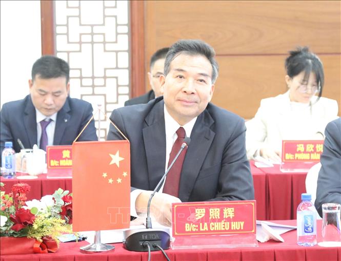Chairman of the China International Development Cooperation Agency (CIDCA) Luo Zhaohui speaks at the talks. VNA Photo: Quang Duy