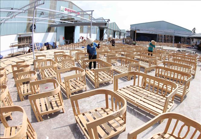 Wood products by the Hiep Long Fine Furniture Co. Ltd in Thuan An town. VNA Photo: Vũ Sinh