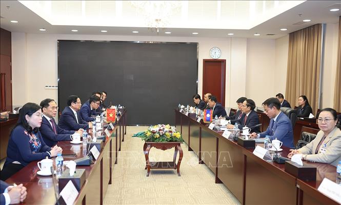 Thủ tướng Phạm Minh Chính gặp đồng chí Bounthong Chitmany, Thường trực Ban Bí thư, Phó Chủ tịch nước Lào. Ảnh: Dương Giang-TTXVN