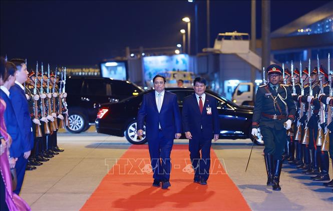 Lễ tiễn Thủ tướng Phạm Minh Chính rời Vientiane, kết thúc chuyến thăm Lào và đồng chủ trì Kỳ họp lần thứ 47 Ủy ban liên Chính phủ Việt Nam - Lào. Ảnh: Dương Giang-TTXVN
