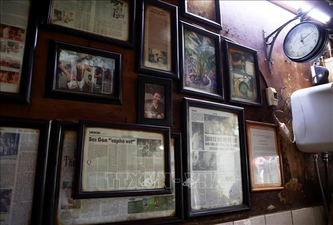 The shop dedicates a space for news articles about its own history and stories. VNA Photo: Hồng Đạt