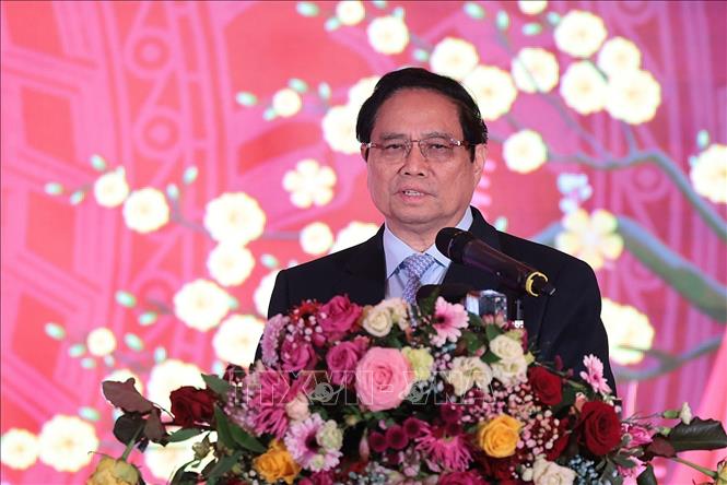 Prime Minister Pham Minh Chinh extends Tet greetings to the Vietnamse community in Poland. VNA Photo: Dương Giang