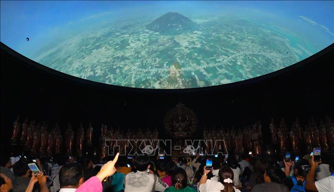 Visitors enjoy a 3D movie documenting the history of Ba Den mountain. VNA Photo: Minh Phú