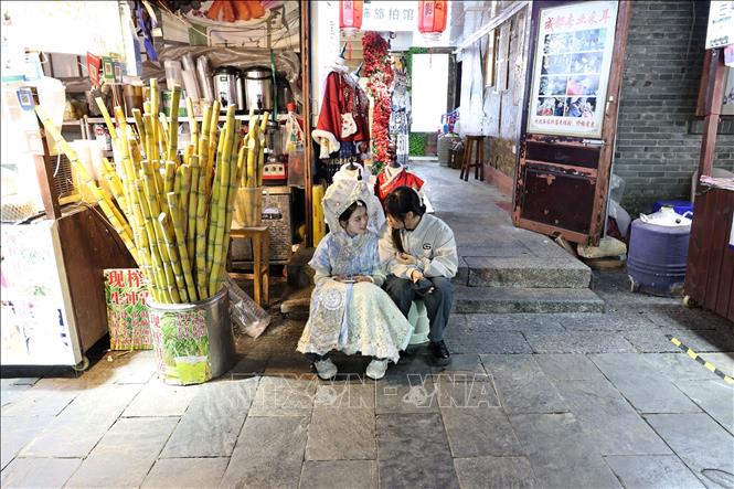 Quán nước mía trong khu phố đêm. Ảnh: Quang Hưng - PV TTXVN tại Trung Quốc  