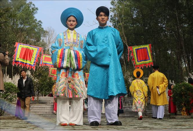 Performing traditional costumes during the Huyen Tran Temple Festival. VNA Photo